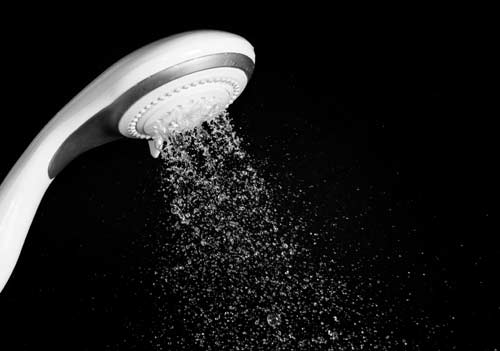 Low water pressure causes water to trickle out of a shower head