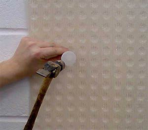 Fit a mesh membrane to your wall to prevent damp from washing salts into your plaster