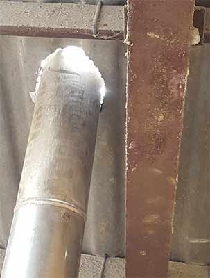 Hole cut and flue poked through